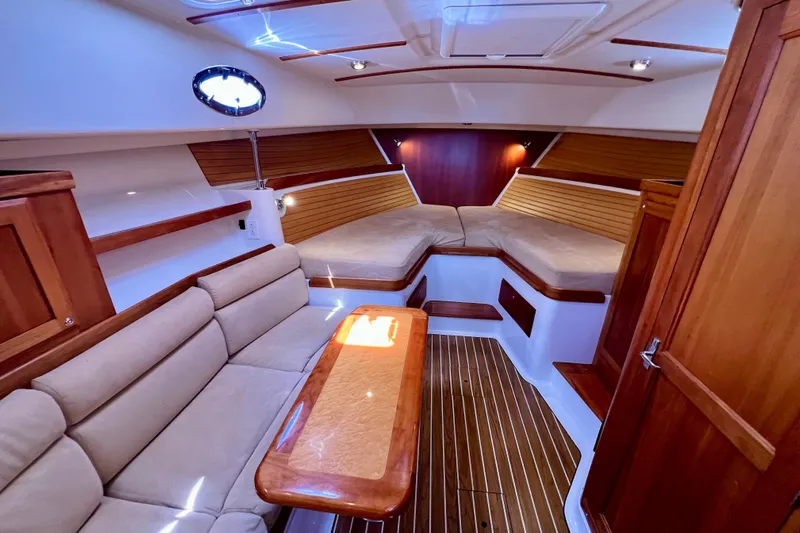 Cabrillo Yacht Photos Pics Luxurious interior of 2008 Back Cove 33 Express yacht with cozy seating and elegant wood finishes.