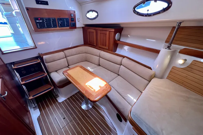 Cabrillo Yacht Photos Pics 2008 Back Cove 33 Express interior with cozy seating and wooden accents.