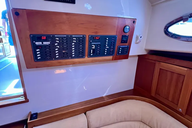 Cabrillo Yacht Photos Pics Electrical panel inside a 2008 Back Cove 33 Express boat cabin.