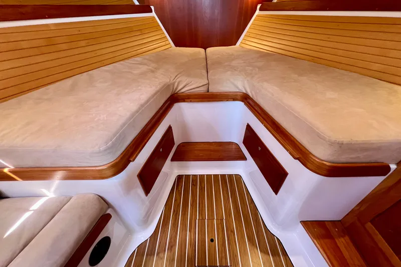 Cabrillo Yacht Photos Pics Interior of 2008 Back Cove 33 Express with wooden accents and cushioned seating.