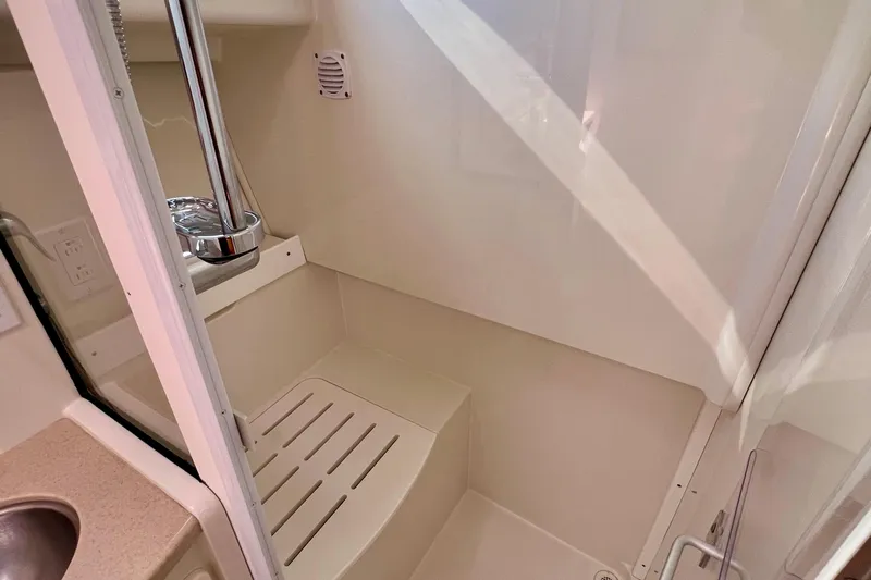 Cabrillo Yacht Photos Pics 2008 Back Cove 33 Express shower area with chrome fixtures and beige interior.