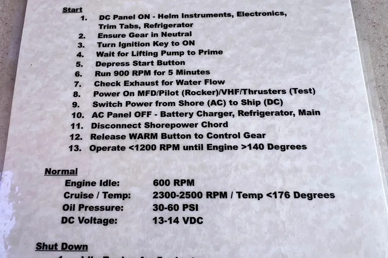 Cabrillo Yacht Photos Pics 2008 Back Cove 33 Express engine start and operation instructions on a laminated sheet.