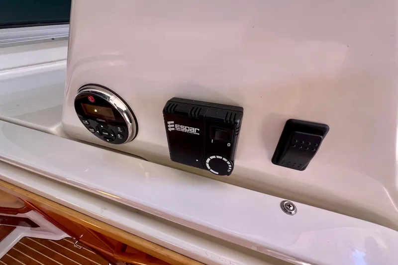 Cabrillo Yacht Photos Pics Control panel on a 2008 Back Cove 33 Express boat, featuring various switches and dials.