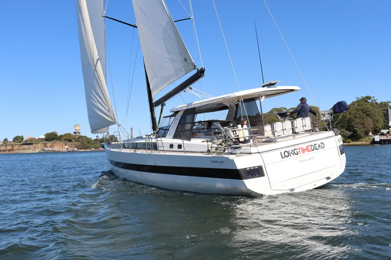 Long Time Dead Yacht Photos Pics 2017 Beneteau Oceanis Yacht 62 sailing on a sunny day, rear view.