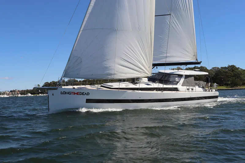 Long Time Dead Yacht Photos Pics 2017 Beneteau Oceanis Yacht 62 sailing on a sunny day, white sails fully extended.