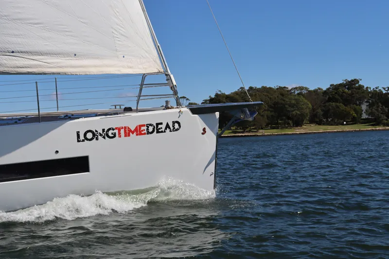Long Time Dead Yacht Photos Pics Beneteau Oceanis Yacht 62 sailing on water, 2017 model, with "LONGTIMEDEAD" text on hull.