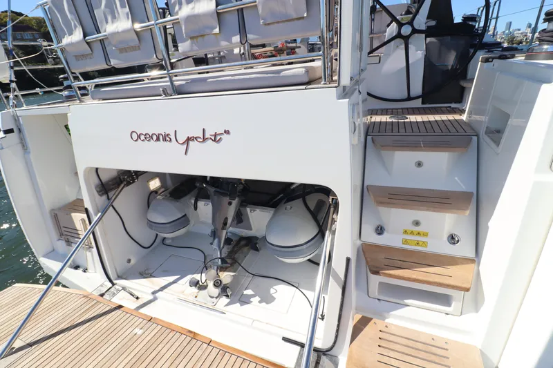 Long Time Dead Yacht Photos Pics 2017 Beneteau Oceanis Yacht 62 stern view with open storage and steps.