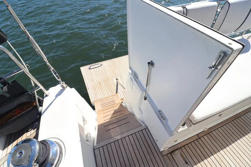 Long Time Dead Yacht Photos Pics Beneteau Oceanis Yacht 62, 2017 model, featuring a teak deck and open hatch.