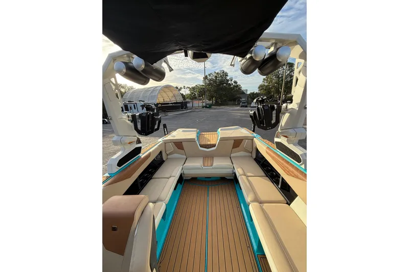  Yacht Photos Pics 2023 Nautique Super Air Nautique S23 interior with tan seating and modern design.