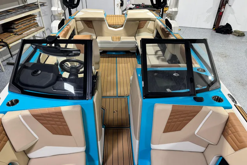  Yacht Photos Pics 2023 Nautique Super Air Nautique S23 interior with tan and blue accents.