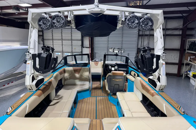  Yacht Photos Pics 2023 Nautique Super Air Nautique S23 interior with premium seating and advanced sound system.