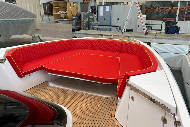 Manda 07 Yacht Photos Pics 2024 Frauscher 1414 Demon Air boat with vibrant red seating and sleek wooden deck.