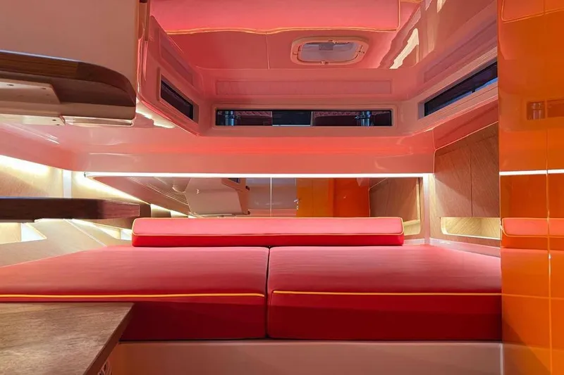 Manda 07 Yacht Photos Pics Luxurious interior of 2024 Frauscher 1414 Demon Air yacht with vibrant red seating.