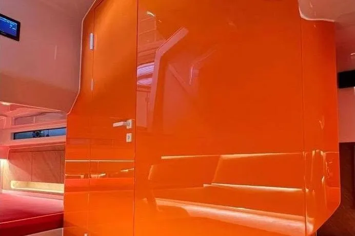 Manda 07 Yacht Photos Pics 2024 Frauscher 1414 Demon Air interior with vibrant orange paneling and modern design.