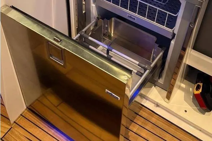 Manda 07 Yacht Photos Pics 2024 Frauscher 1414 Demon Air yacht interior with open stainless steel refrigerator.