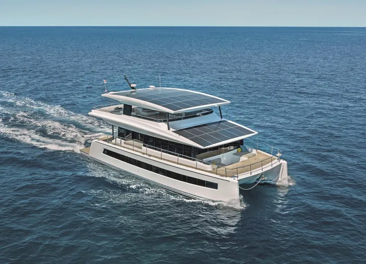  Yacht Photos Pics Silent 62 yacht cruising on open sea, featuring solar panels, 2026 model.