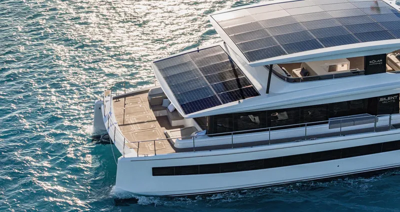  Yacht Photos Pics Silent 62 yacht, 2026 model, with solar panels cruising on clear blue water.