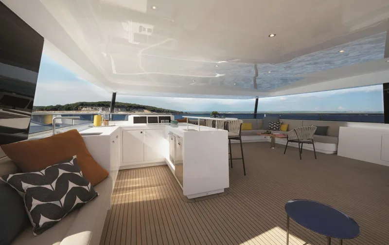  Yacht Photos Pics Luxurious 2026 Silent 62 yacht interior with modern seating and ocean view.