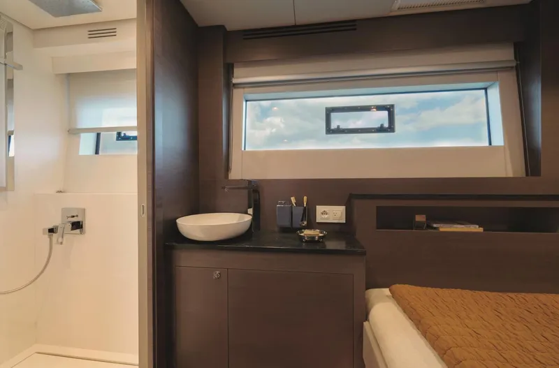  Yacht Photos Pics Luxurious interior of 2026 Silent 62 yacht with modern bathroom and cozy bedroom.