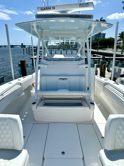  Yacht Photos Pics 2020 Invincible 36' Open Fisherman boat docked, featuring spacious seating and advanced navigation equipment.