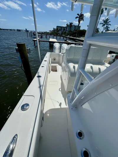  Yacht Photos Pics 2020 Invincible 36' Open Fisherman boat docked by the water.