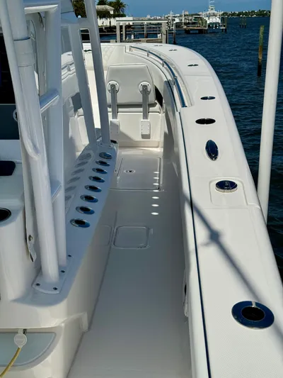  Yacht Photos Pics 2020 Invincible 36' Open Fisherman boat docked by the water.
