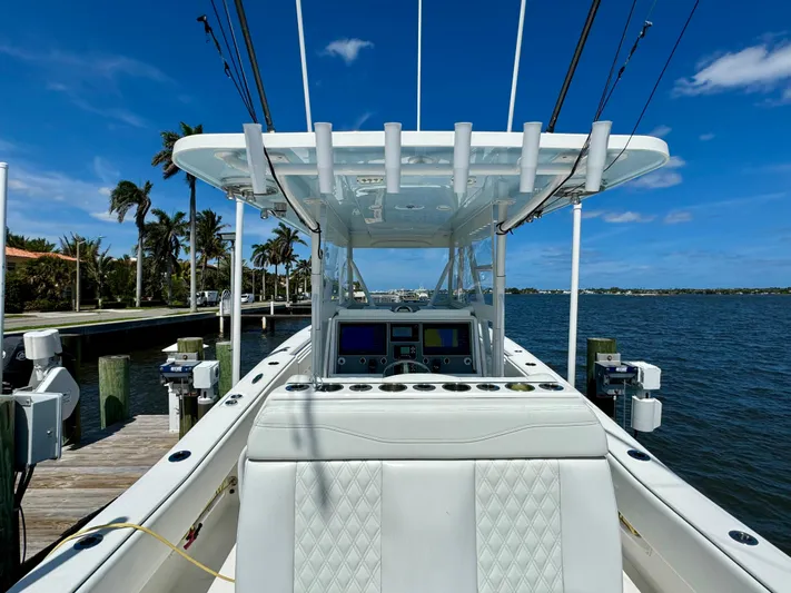  Yacht Photos Pics 2020 Invincible 36' Open Fisherman boat docked by the water.