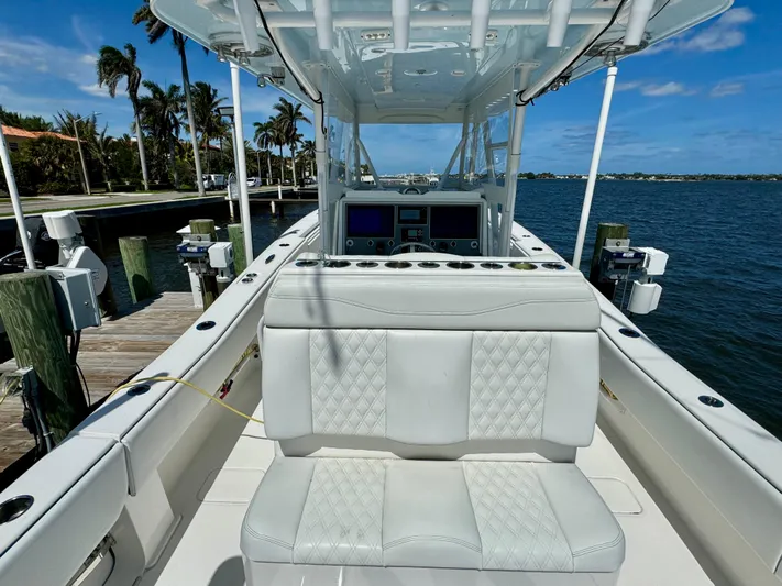  Yacht Photos Pics 2020 Invincible 36' Open Fisherman boat docked by the water.