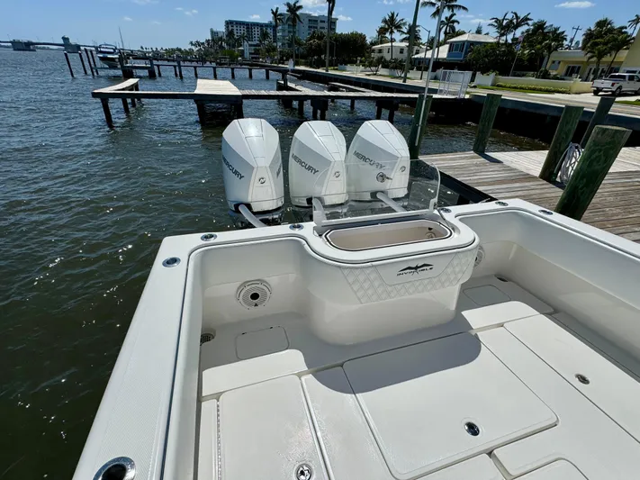  Yacht Photos Pics 2020 Invincible 36' Open Fisherman with triple Mercury outboard engines at dock.