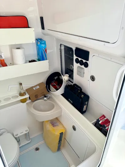  Yacht Photos Pics 2020 Invincible 36' Open Fisherman boat interior with sink and storage compartments.