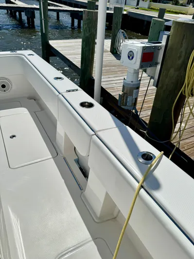  Yacht Photos Pics 2020 Invincible 36' Open Fisherman boat docked, showing clean deck and fishing rod holders.