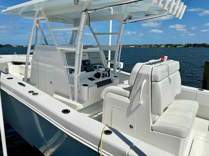  Yacht Photos Pics 2020 Invincible 36' Open Fisherman boat with white seating and control panel.