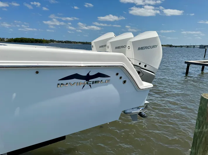  Yacht Photos Pics 2020 Invincible 36' Open Fisherman boat with triple Mercury engines on the water.