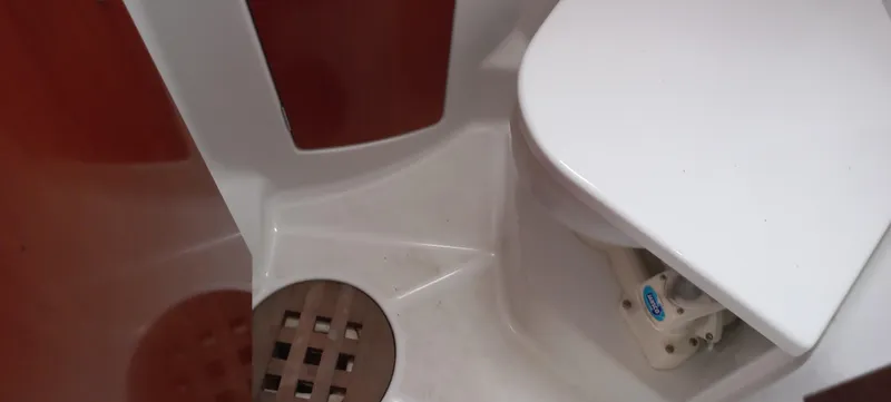 Kaskara Yacht Photos Pics Bathroom area of 2007 Beneteau Oceanis Clipper 523 yacht, featuring a compact toilet.