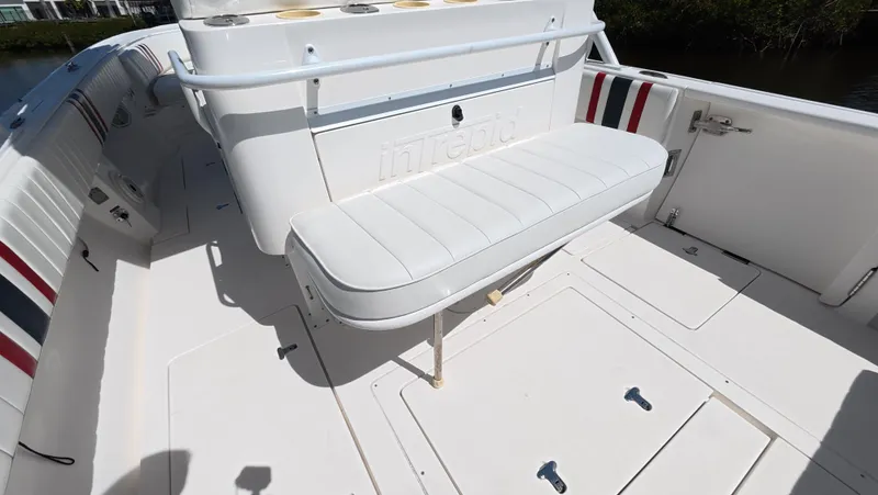 Johnny Be Good Yacht Photos Pics 2012 Intrepid 327 CC boat interior with white seating and storage compartments.