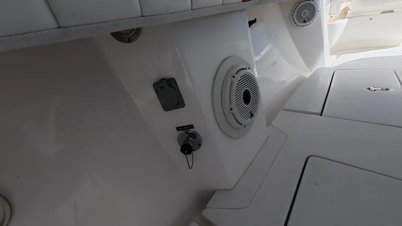 Johnny Be Good Yacht Photos Pics 2012 Intrepid 327 CC boat interior with speaker and control panel.