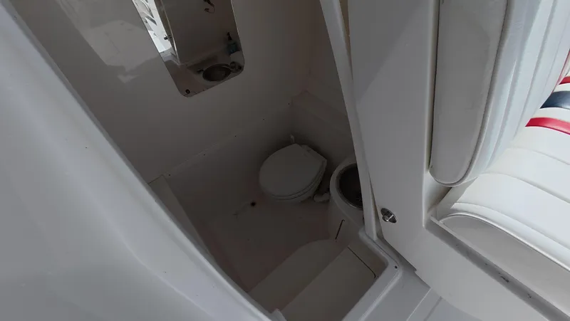 Johnny Be Good Yacht Photos Pics 2012 Intrepid 327 CC boat interior with compact marine toilet and sink.