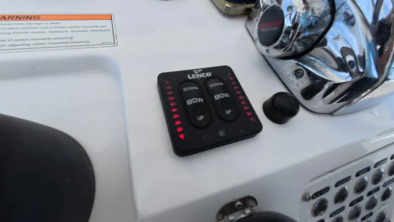 Johnny Be Good Yacht Photos Pics Control panel on a 2012 Intrepid 327 CC boat dashboard with Lenco trim tab switches.