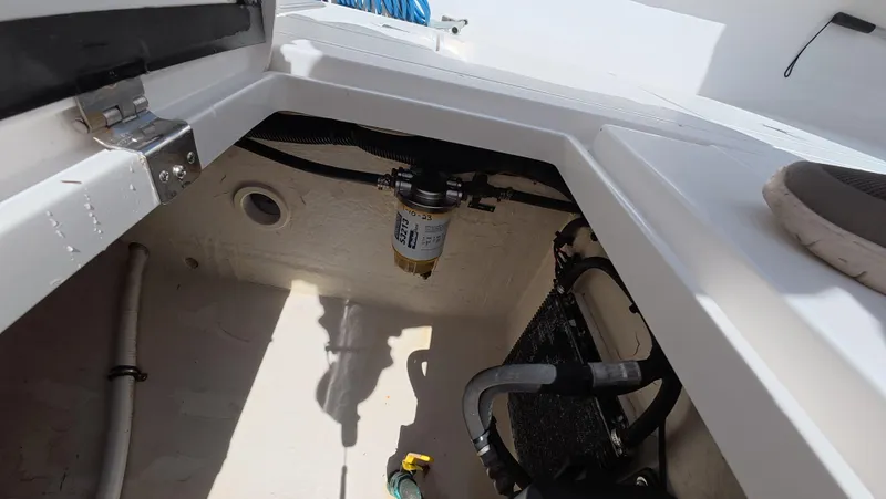 Johnny Be Good Yacht Photos Pics 2012 Intrepid 327 CC boat interior showing mechanical components and storage area.