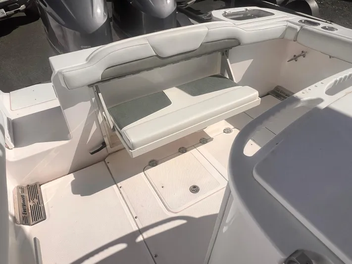  Yacht Photos Pics 2015 Everglades 295 Pilot boat interior with foldable seating and storage compartments.