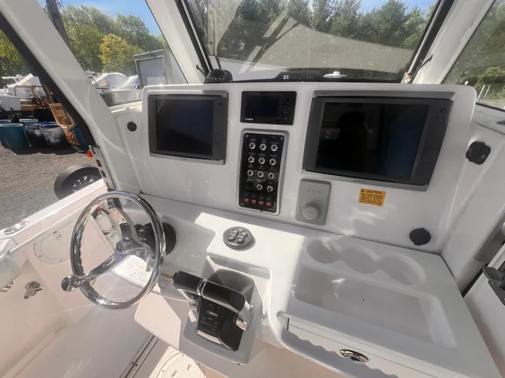  Yacht Photos Pics 2015 Everglades 295 Pilot boat dashboard with dual screens and control panel.