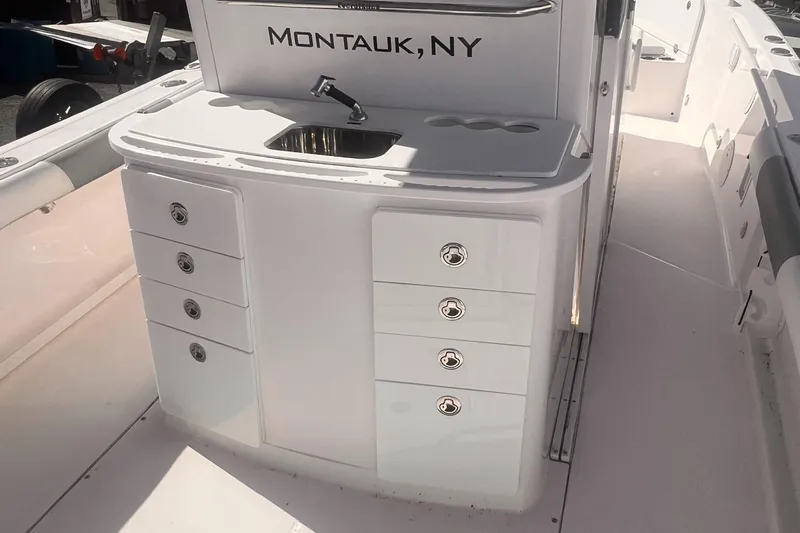  Yacht Photos Pics 2015 Everglades 295 Pilot boat interior with sink and storage, labeled Montauk, NY.