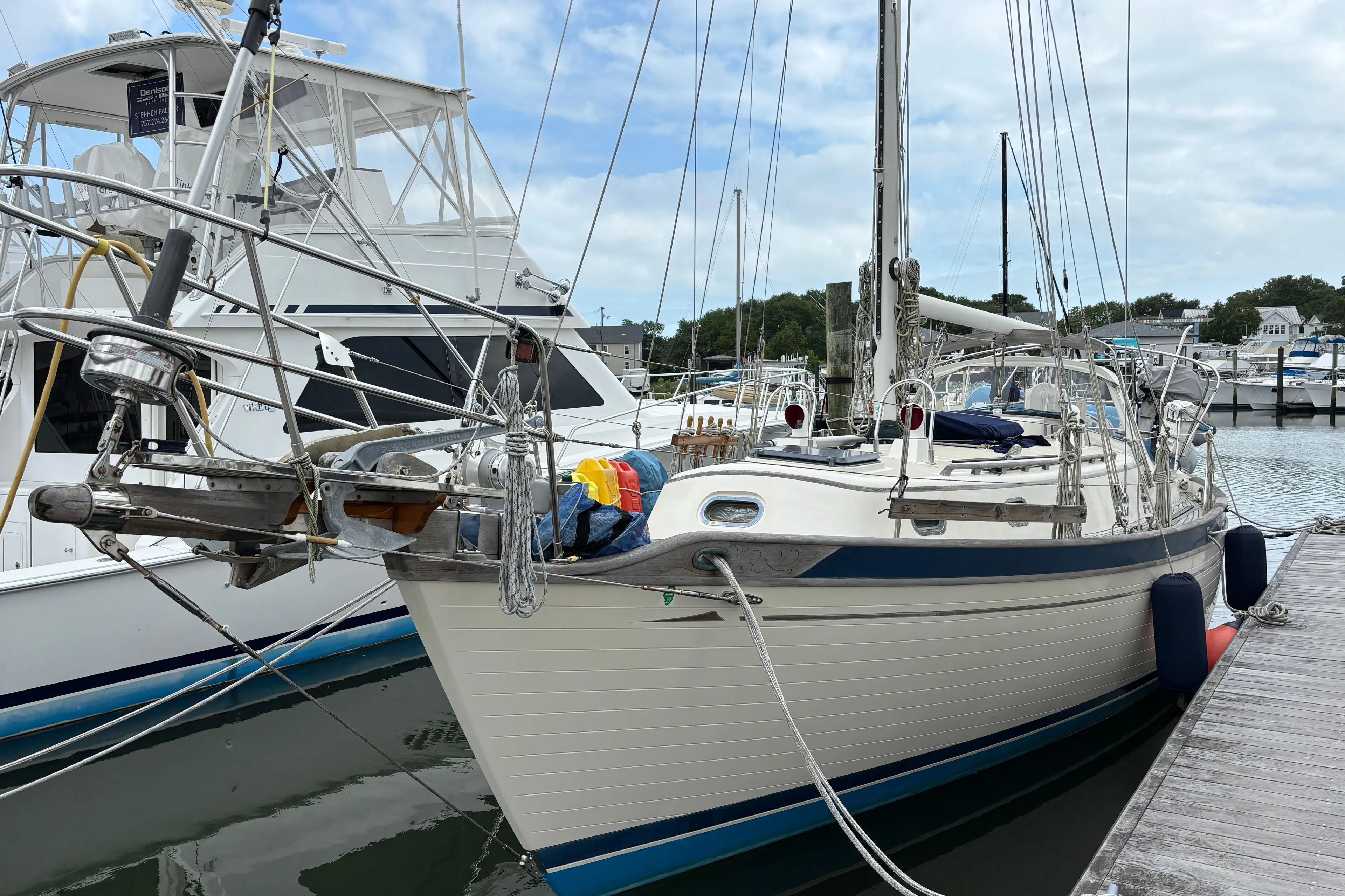 1987 Ta Shing Tashiba 36 sailboat docked at marina, clear sky background.