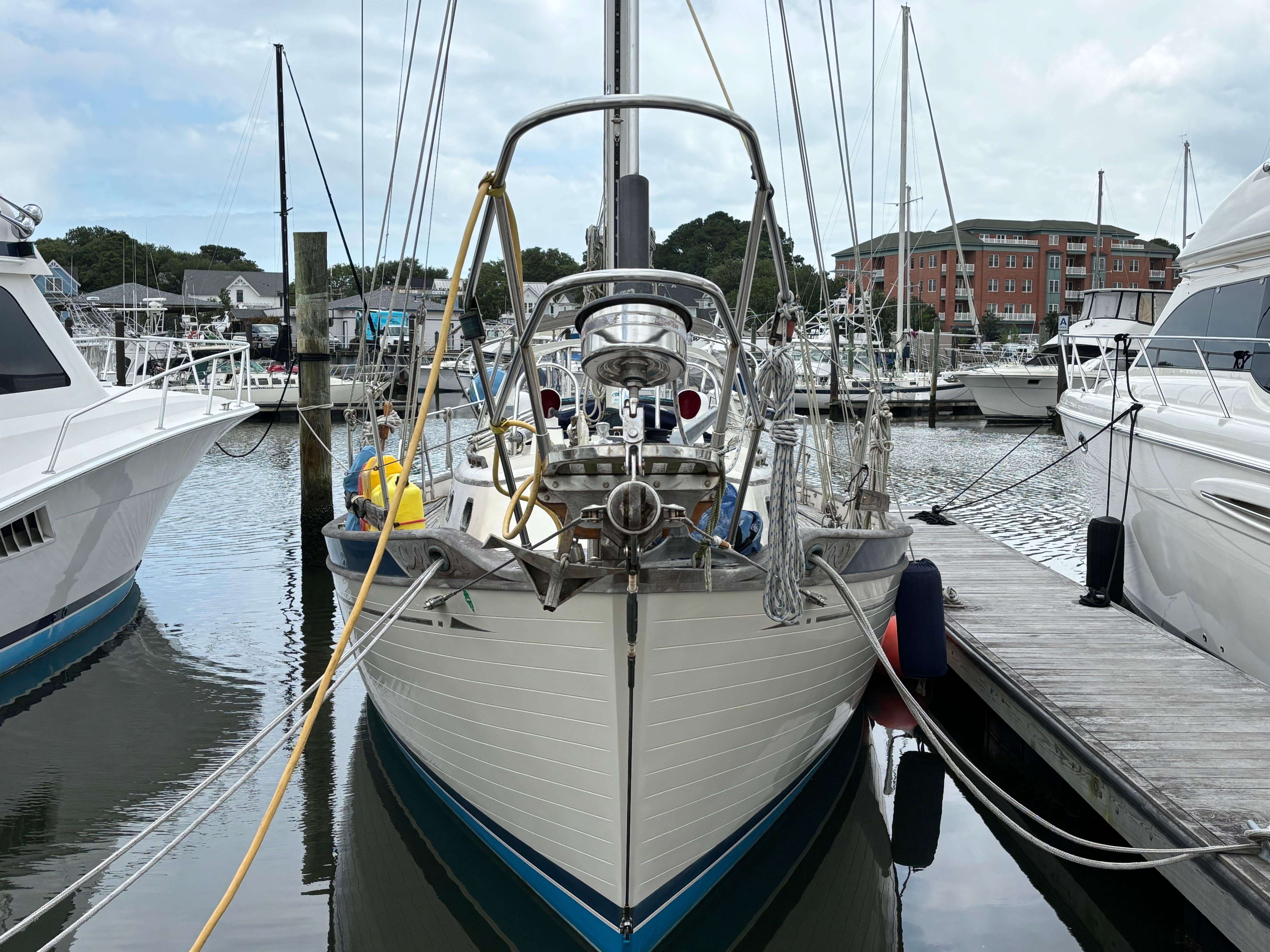 1987 Ta Shing Tashiba 36 sailboat docked at marina, surrounded by other boats.