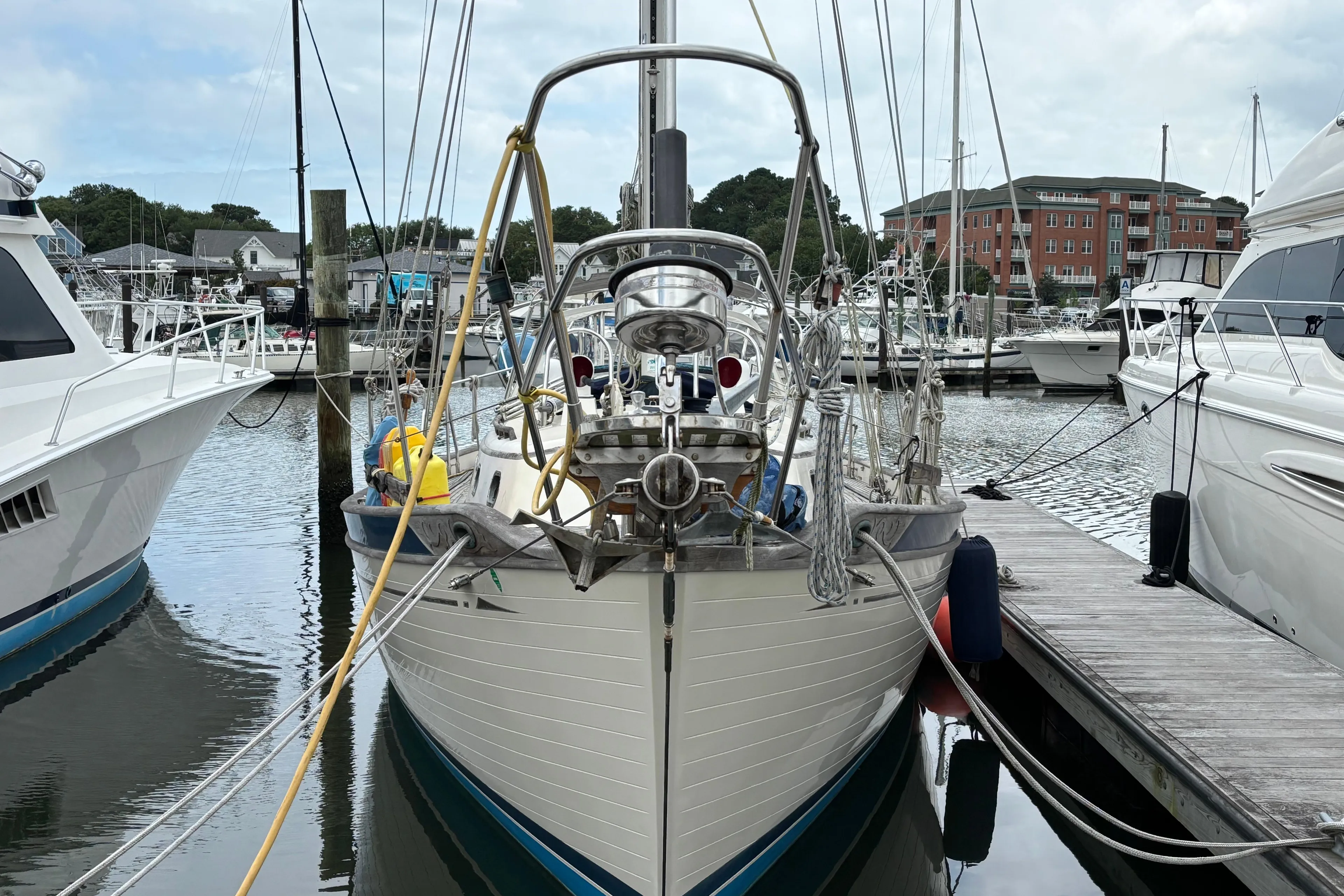 1987 Ta Shing Tashiba 36 sailboat docked at marina, surrounded by other boats.