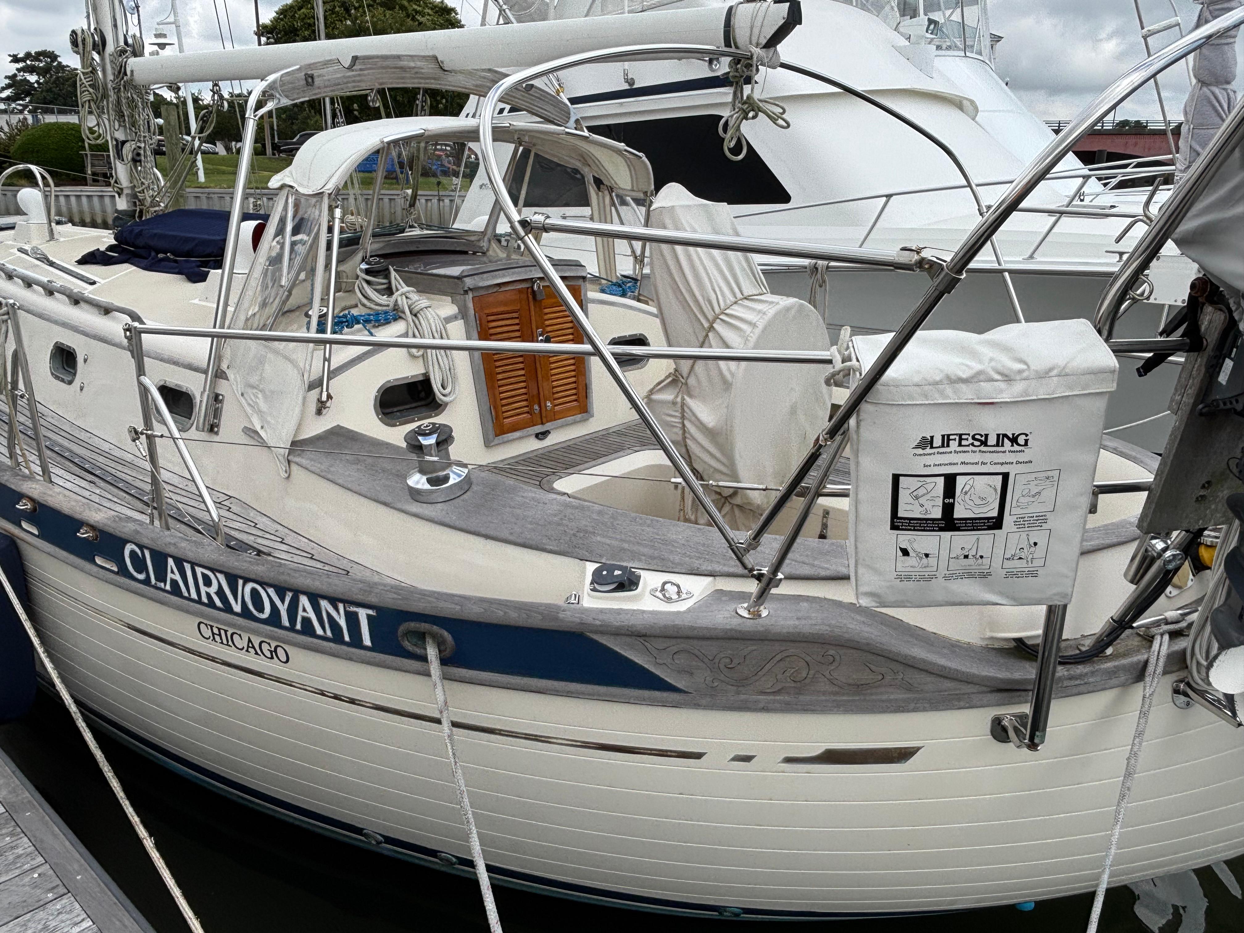 1987 Ta Shing Tashiba 36 sailboat named "Clairvoyant" docked, featuring a Lifesling safety device.