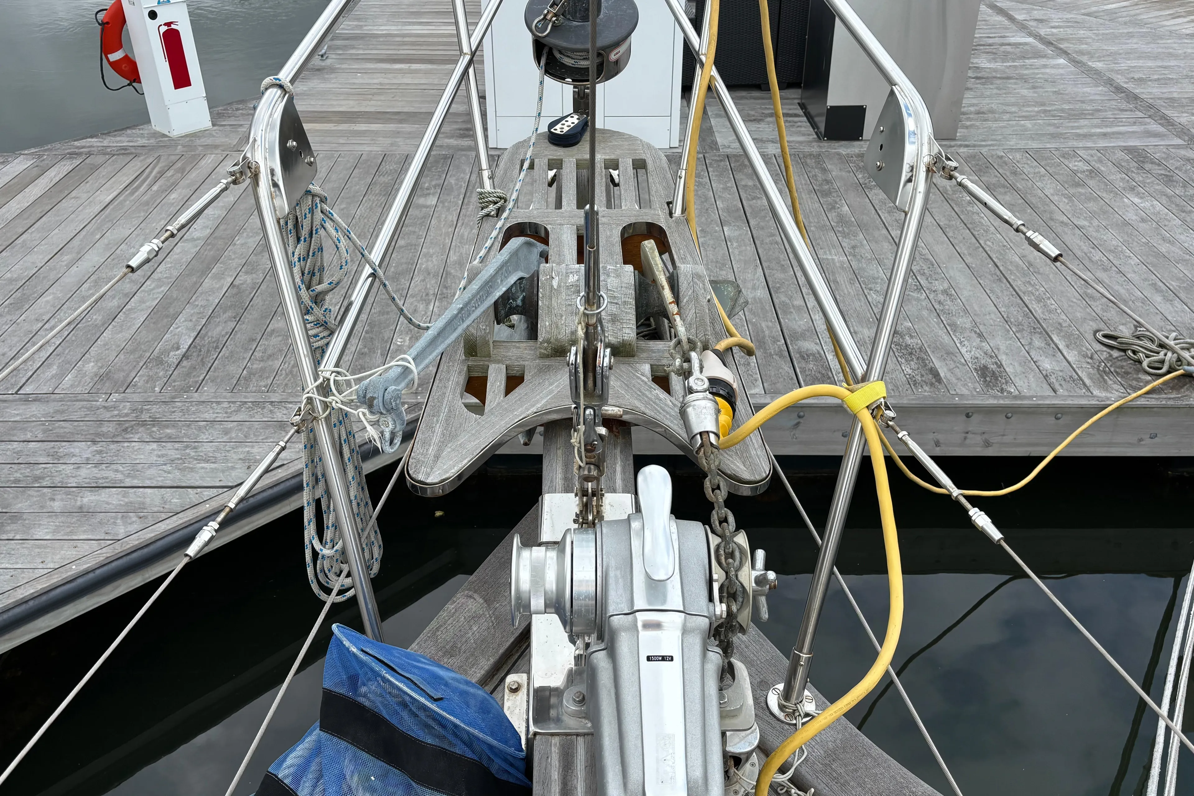Bow of 1987 Ta Shing Tashiba 36 sailboat docked, showing anchor and deck equipment.