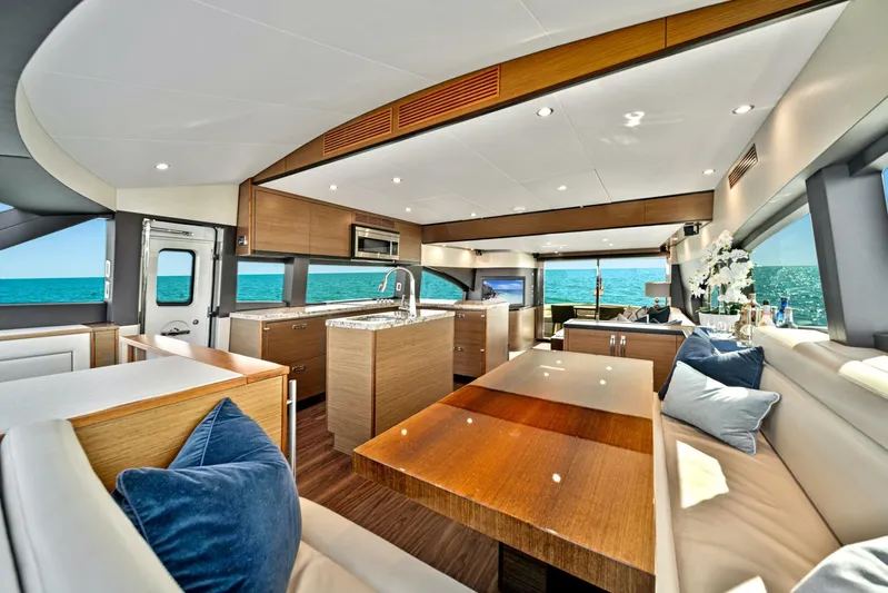 West Yacht Photos Pics Luxurious interior of 2017 Hatteras 60 Motor Yacht with modern kitchen and dining area.