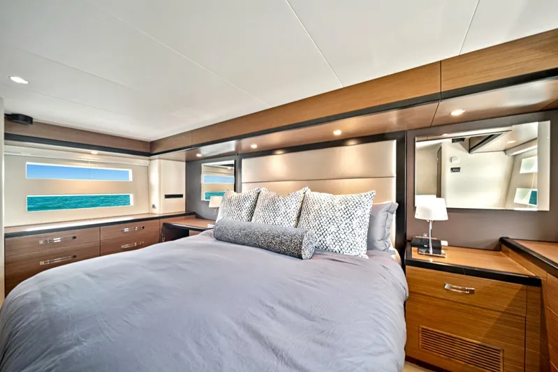 West Yacht Photos Pics Luxurious bedroom interior of 2017 Hatteras 60 Motor Yacht with ocean view.