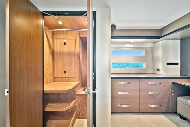 West Yacht Photos Pics Interior of 2017 Hatteras 60 Motor Yacht with wooden cabinetry and ocean view.